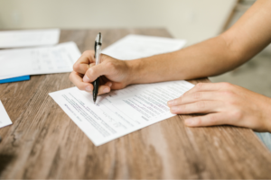 Client is filling out legal paperwork